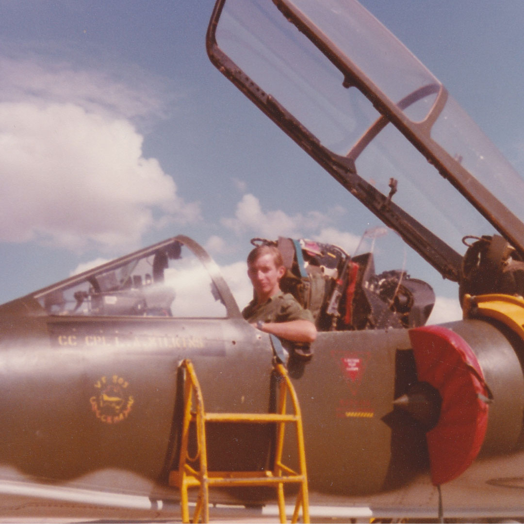 Chris Mathias in the cockpit of a military aircraft