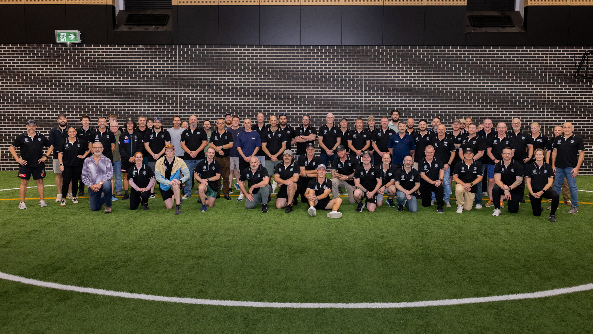 Group of ADF veterans and Port Adelaide Football Club members standing together for the 2025 Veterans Program event.