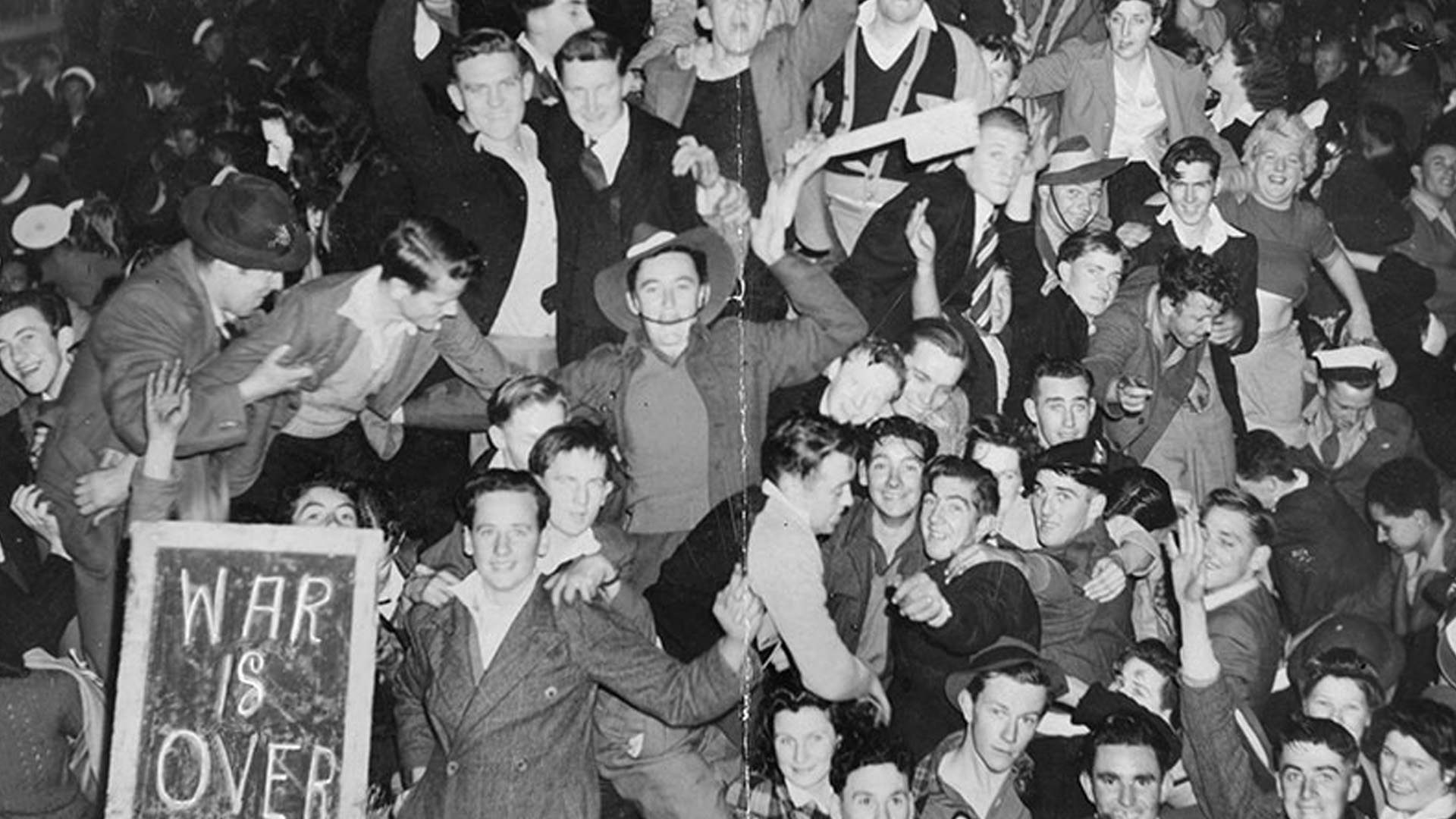 Service men and civilians celebrate in the streets of Sydney at the news of the Japanese surrender, August 1945