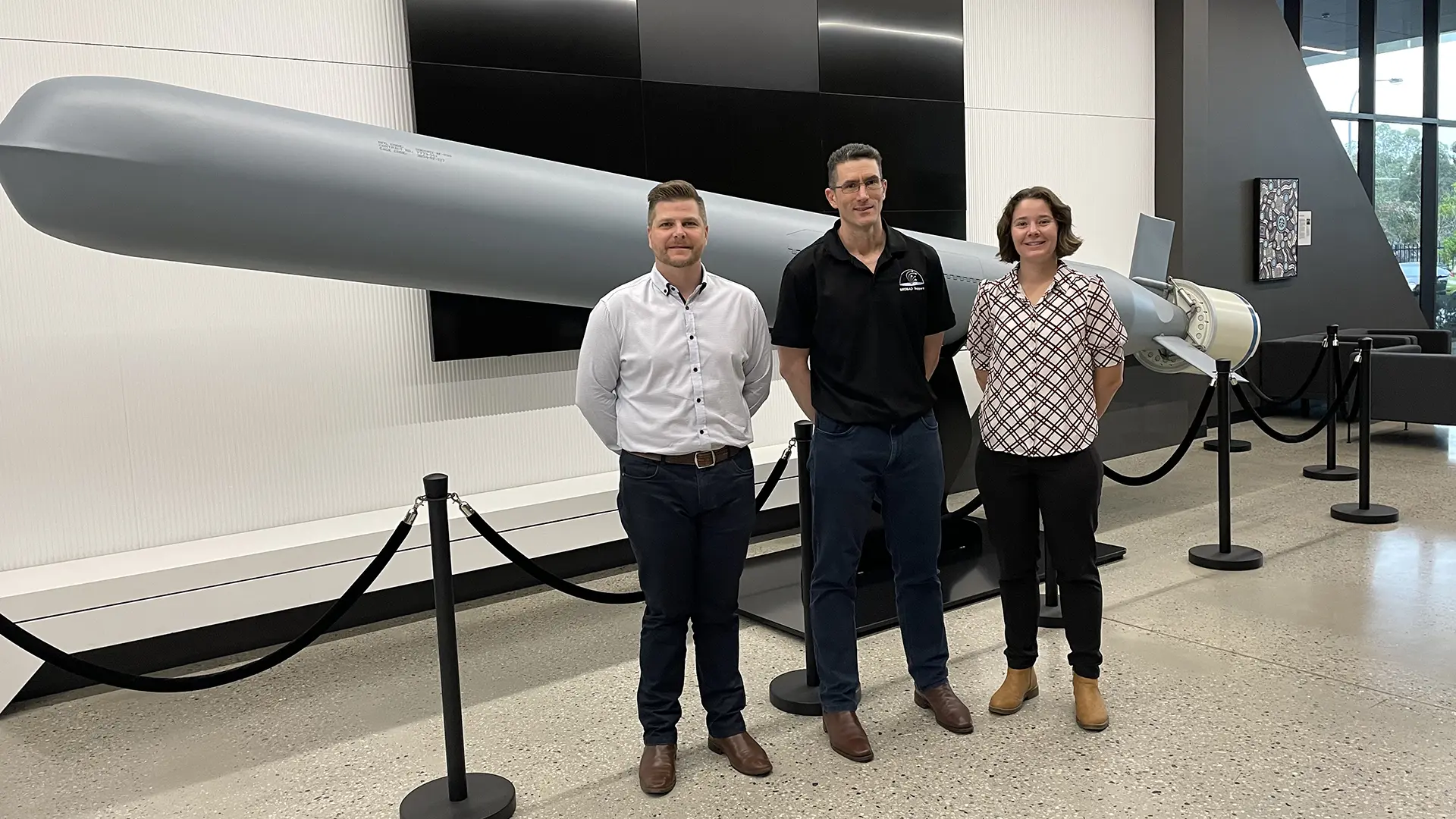Career Connections candidates, Josh (L) and Coral (R) with Raytheon representative Cameron Chapman